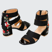 Women wearing black and white patchwork pattern type sandals