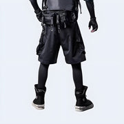 Techwear UK hidden pocket cargo shorts back view – man wearing functional black streetwear shorts with concealed pockets, perfect for urban utility, summer fashion, and techwear outfits.