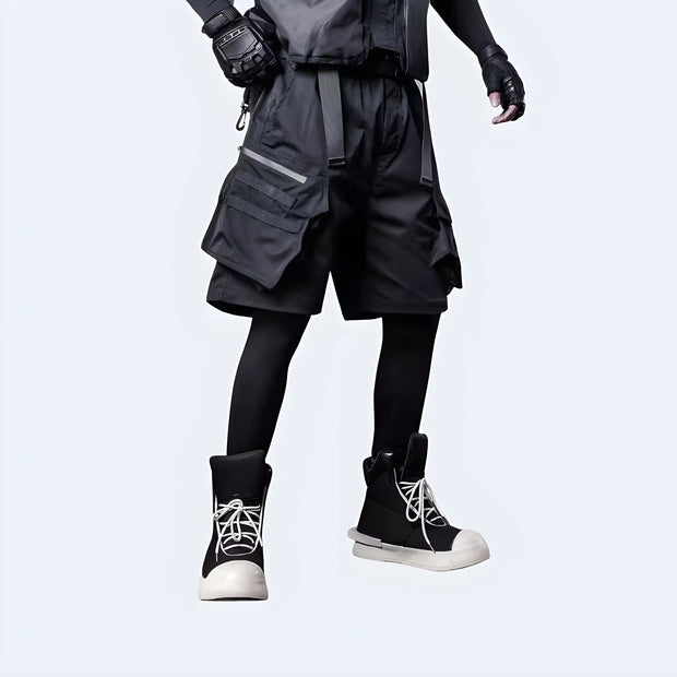 Man wearing Techwear UK hidden pocket cargo shorts front view – urban streetwear shorts with concealed storage, functional techwear design ideal for summer utility and edgy fashion looks.