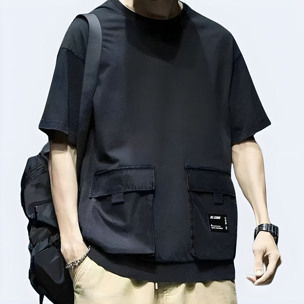 Techwear UK reflective pocket t-shirt front view – Man wearing futuristic techwear t-shirt with reflective chest pocket, modern streetwear style ideal for urban fashion lovers in the UK.