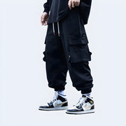 Man wearing big pocket techwear baggy pants multiple pockets both sides