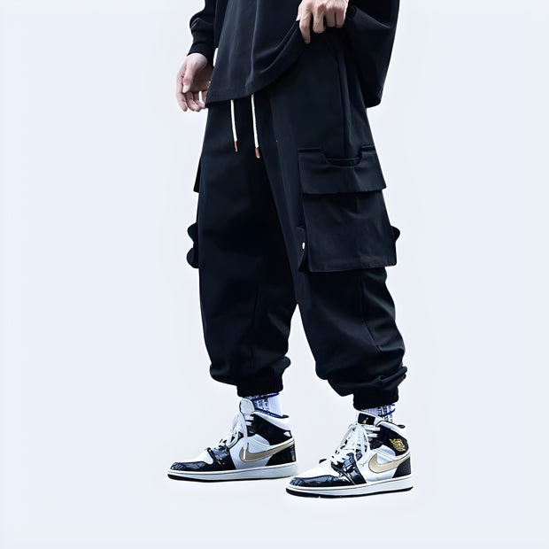 Man wearing big pocket techwear baggy pants multiple pockets both sides