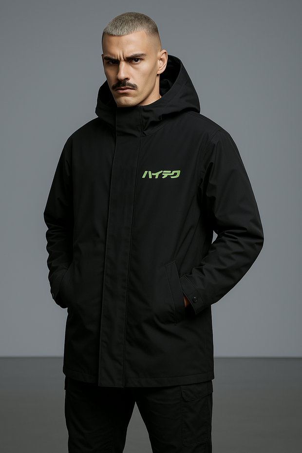 A male model wearing a black hooded jacket with the japanese characters &