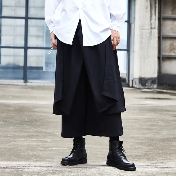 Man wearing black hakama pants men range of sizes front side