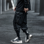 Man in wearing black japanese techwear pants back view 