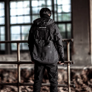 Man wearing black cyberpunk hoodie zip multiple pockets decorations