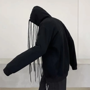 Man wearing black hoodies with strings big pocket on the front
