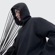 Man wearing black hoodies with strings o-neck collar style