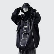Man wearing black tactical poncho hoodie adjustable hood