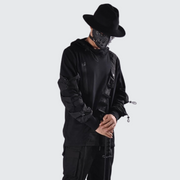 Man wearing black techwear hoodie adjustable hood