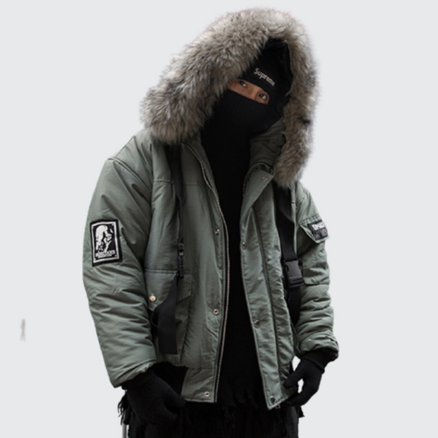 Man wearing green bybb winter parka zipper closure