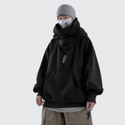 Man wearing black high neck hoodie with pockets