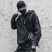 Man wearing black techwear hoodie shirt