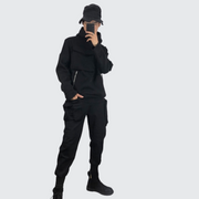 Man wearing black techwear turtleneck hoodie adjustable hood