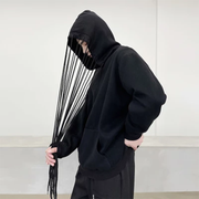 Man wearing black hoodies with strings