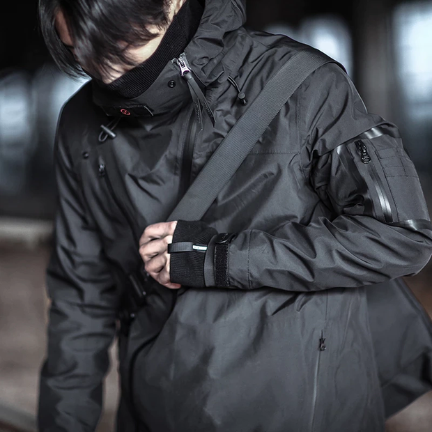 Man wearing cyberpunk hoodie zip elastic on ends of sleeves