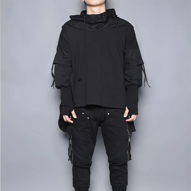 Man wearing hooded poncho sweater layered style sweater