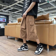 Brown cropped cargo pants man in side view