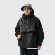 Man wearing black cargo jacket with hood zipper closure